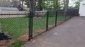 “Black chain-link backyard fence”